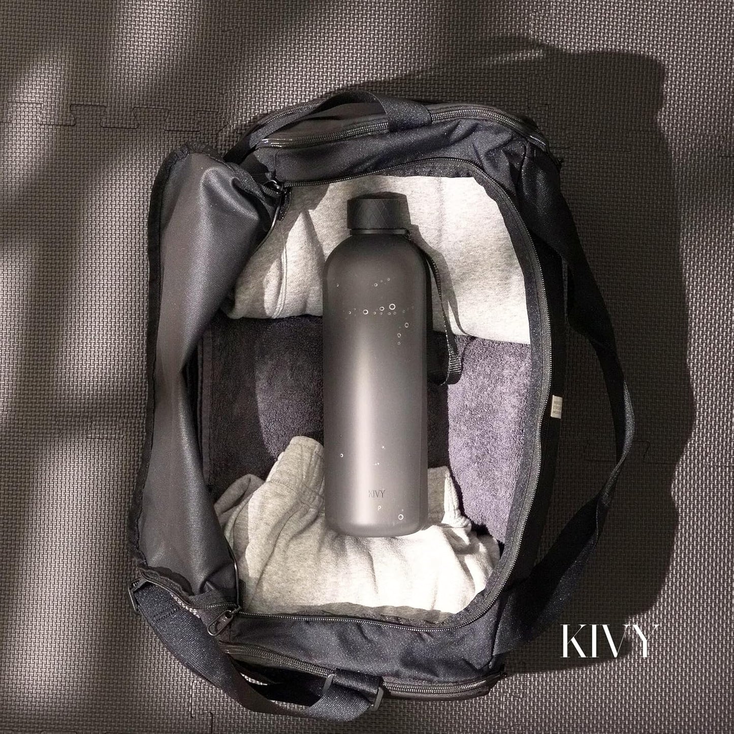 KIVY Large Water Bottle 50oz [Lightweight & Shatterproof] - Fits Backpack & Cupholder for Travel, Sports, School - Clear, No Straw, 1.5 Liter